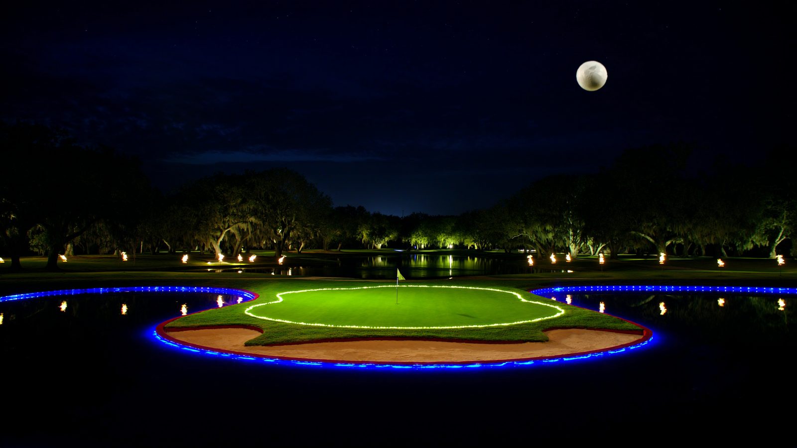 The moon over a glowing island green